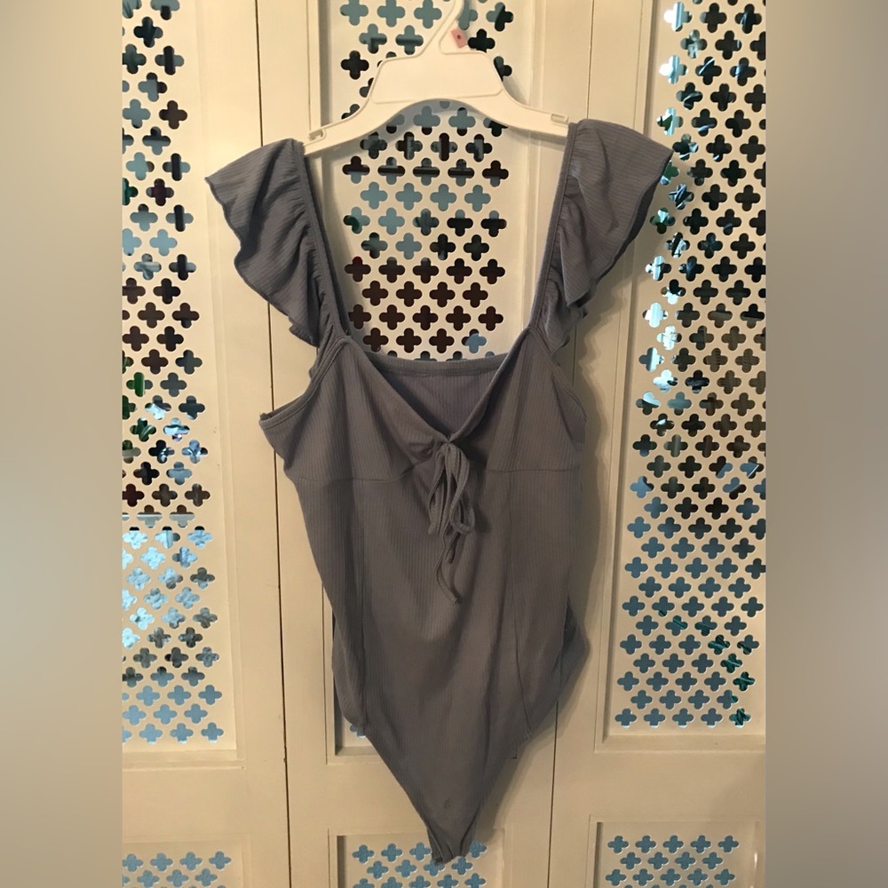 Light blue ribbed bodysuit with ruffle straps from Cider
